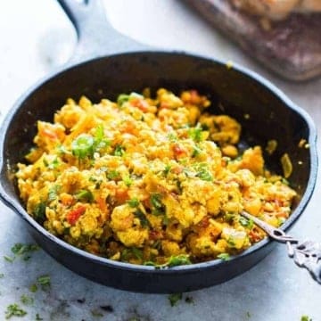 Paneer bhurji served in a cast iron pan