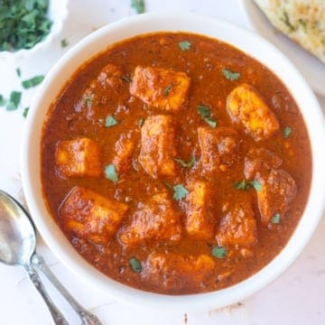 paneer vindaloo served in a white bowl