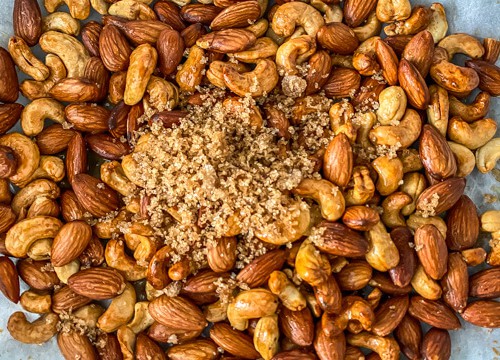 Brown sugar added to roasted nuts