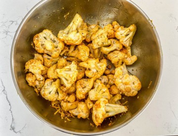 Cauliflower that has been tossed in oil and seasoning.