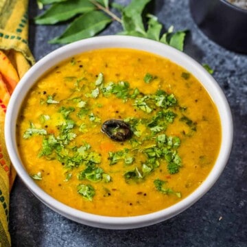 A bowl of Gujarati Dal garnished with cilantro.