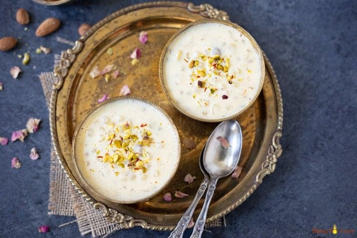Two bowls of Sabudana kheer served in a metal plate
