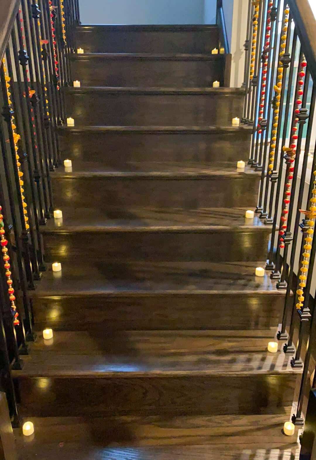 Stairs lined with candles and flowers