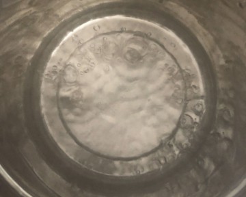 Water being boiled in a steel steamer