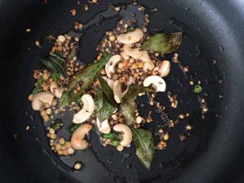 Green chilies, cashew nuts, curry leaves, mustard seeds and cumin seeds tempered in ghee