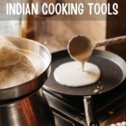 A ladle pouring dosa batter in a non-stick pan with caption Essential list of Indian Cooking Tools